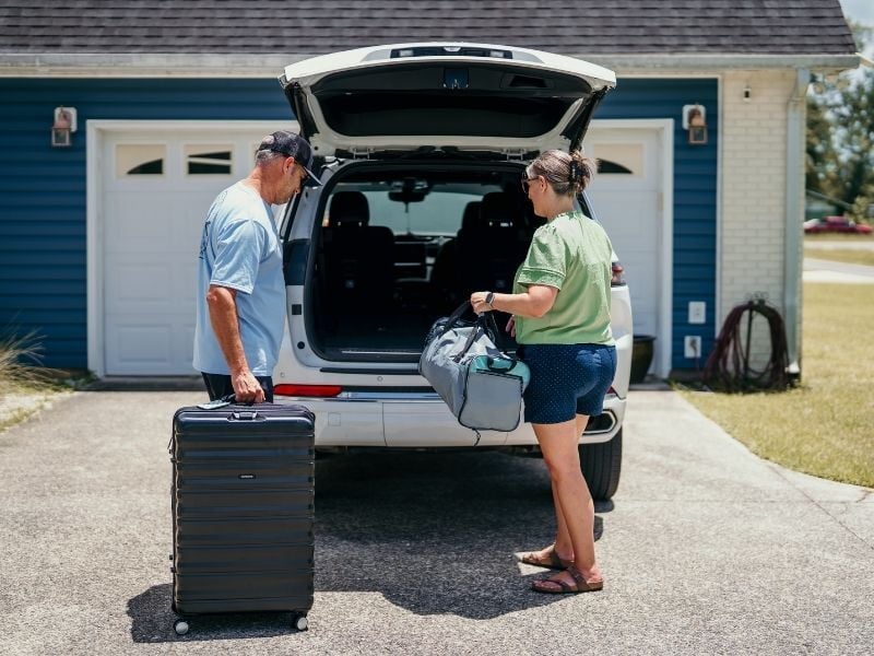 Couple packing the car to travel