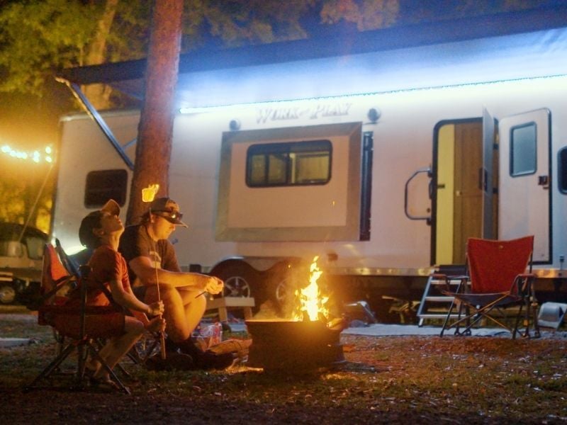 Father and son camping RV