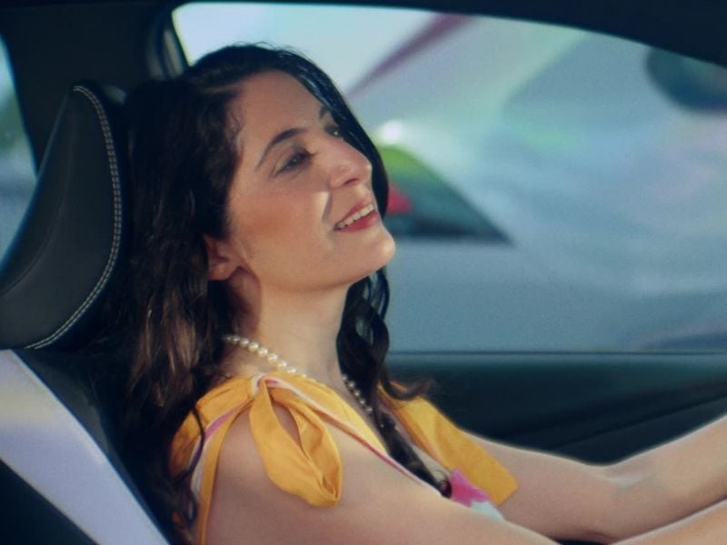 Happy woman in car