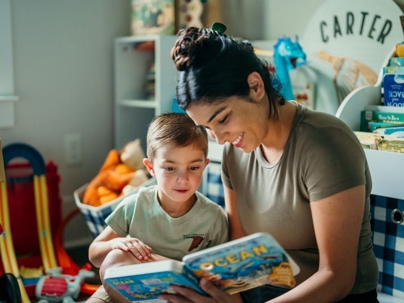 Mom and son reading in son’s room