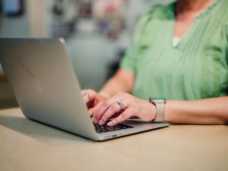 Woman typing on computer
