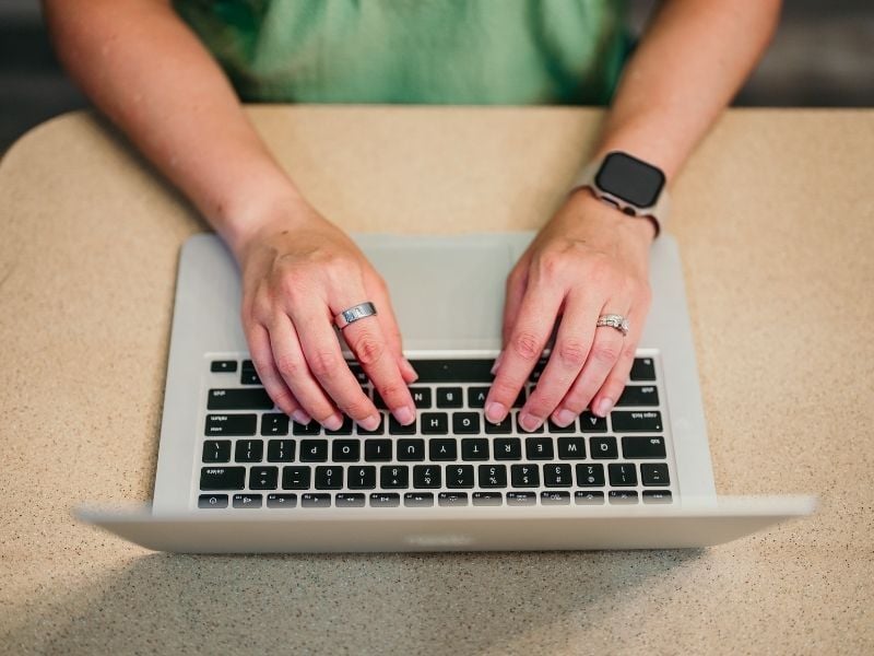 Woman typing on laptop